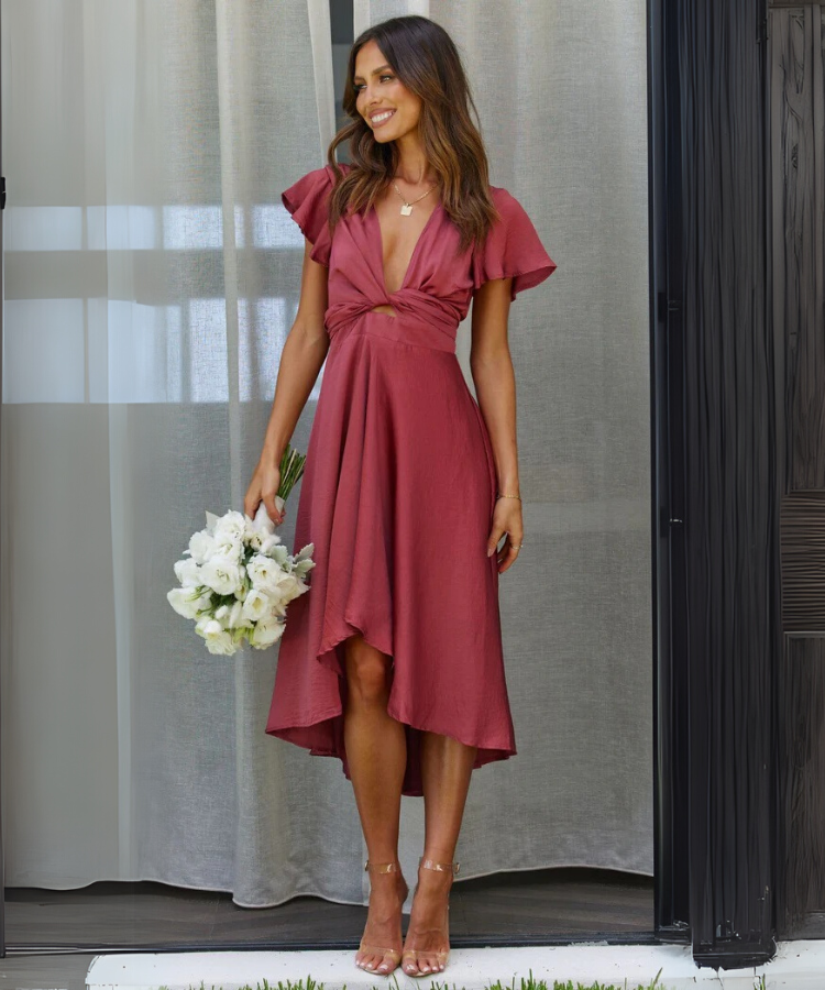 Elegenta jurk met lage hals en strik