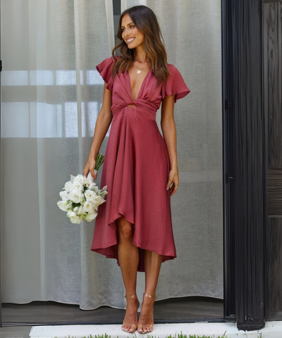 Elegenta jurk met lage hals en strik